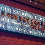 U.S. National Debt Clock displaying current debt figures.