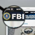 FBI Nabs Most Wanted – 10 Year Manhunt ENDED! FBI website shown through magnifying glass.