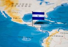 Map of Central America with a flag of El Salvador pinned on it