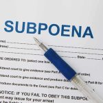 Trump SUBPOENAS Walz, Cronies Included – Probe Launched A subpoena document with a blue pen resting on it