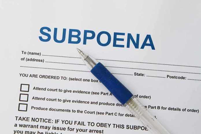 shutterstock_139897957 (1) (1).jpg A subpoena document with a blue pen resting on it