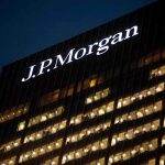 Trump SUING JP Morgan Chase – It’s Payback! Illuminated J.P. Morgan building at night with visible office windows