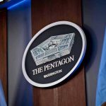 Pentagon Fires Sicko Male ‘Transgender Wolf’ Kindergarten Teacher The Pentagon emblem between two flags.