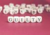 Anti-ICE Rebels GUILTY – Judge Drops Hammer Dice spelling GUILTY on a red surface.
