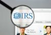 Magnifying glass over IRS website.