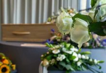 Hero TV Star Dead At 54! White roses in front of a casket.