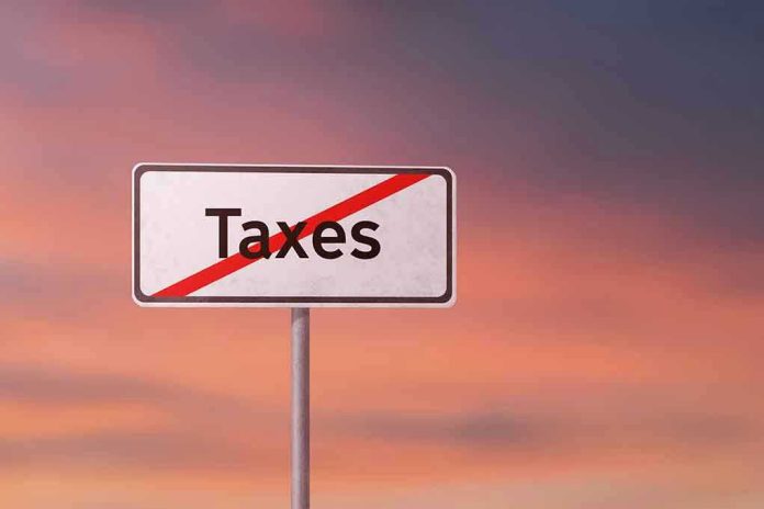 Sign with the word Taxes crossed out.