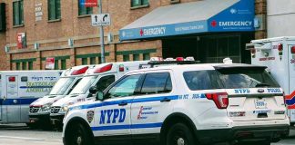 Caught on Video: Police Captain’s Shocking Protest Remarks Police car and ambulances outside emergency room entrance.