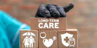 Revolutionary Medical Kits: The New Doctor? Gloved hand holding longterm care wooden blocks