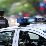 HOT CAR TRAGEDY: Child’s Death Sparks Investigation Police car and officer on a city street.
