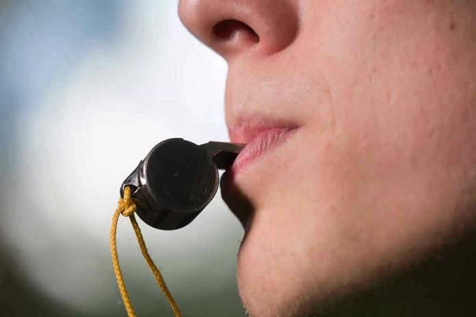 409401709 Person holding a whistle in their mouth.