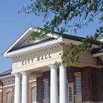 Misconduct Explodes: Judge’s Secret Affair Uncovered Exterior view of a city hall building with columns and a clear blue sky