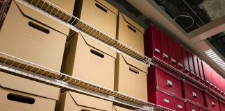 Lost Genetic Results—Faces Lifesaving Consequences Shelves filled with brown and red storage boxes for organizing documents