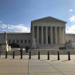Iowa Shock: Fake Identity, Real Consequences Supreme Court building with flag and people outside.