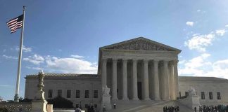 Iowa Shock: Fake Identity, Real Consequences Supreme Court building with flag and people outside.
