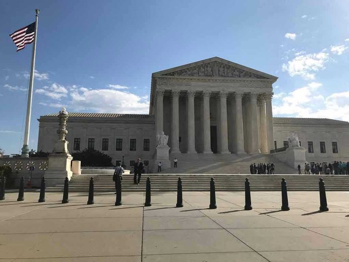 2453289175 Supreme Court building with flag and people outside.