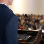 Religion Fuels Political Divide in U.S. A speaker at a podium addressing an audience