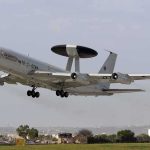 Lithuania Weighs Hosting US Nuclear Weapons NATO AWACS aircraft taking off from an airfield