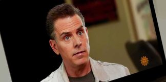 The View Sparks Bias Debate A person with a serious expression during an interview on a laptop