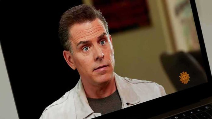 A person with a serious expression during an interview on a laptop