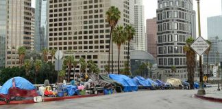 Atlanta’s World Cup Preparations Draw Scrutiny Street lined with tents and makeshift shelters downtown.