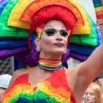 The Pride Event Putting Busch Gardens Back in the Spotlight Drag performer in vibrant rainbow costume at a parade