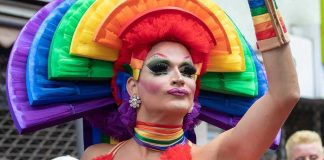 The Pride Event Putting Busch Gardens Back in the Spotlight Drag performer in vibrant rainbow costume at a parade