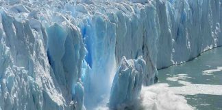Earth Is Heating Faster Than Ever—And Humans Are Driving It A glacier calving into the ocean, creating a splash of ice and water