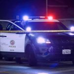 A Burning Car, a Broken Window, and a Miracle Escape Police SUV with flashing lights at night behind yellow tape