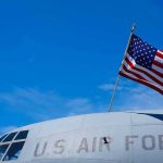 American flag on U.S. Air Force aircraft against blue sky