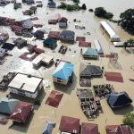 Bertha Exposes the Gap Between Storm Fears and Reality Aerial view of flooded residential neighborhood