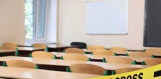 Violence Erupts Inside NYC High School Empty classroom with police tape across desks