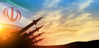 missile silhouettes under Iran flag at sunset
