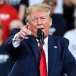 Gas Spike Drama: Trump Calls It Peanuts Man in suit pointing, speaking at a rally.