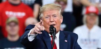 Gas Spike Drama: Trump Calls It Peanuts Man in suit pointing, speaking at a rally.
