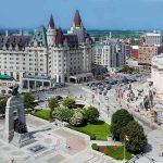 All 9 Skiers Died Trapped Under Castle Peak Snow Urban square with war memorial and grand chateau-style building