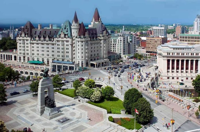 shutterstock_1010036683 Urban square with war memorial and grand chateau-style building