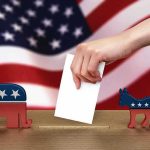 Judge Throws Out Nevada Elector Case Hand casting ballot between Republican elephant and Democratic donkey
