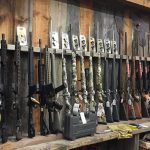 rack of rifles and shotguns in a gun store