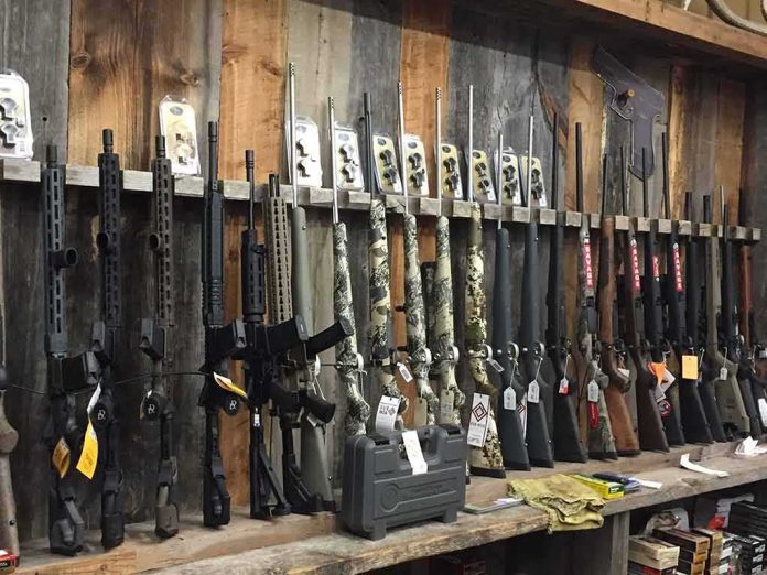 shutterstock_1047779650 rack of rifles and shotguns in a gun store