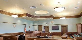 Parents vs. Texas: Who Controls Religion in the Classroom? Empty courtroom with wooden benches and judge's bench