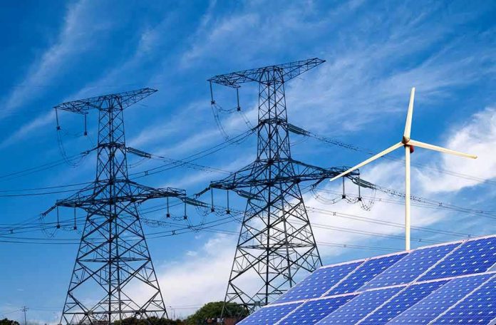 Power lines with wind turbine and solar panels