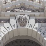 China Agent Case Triggers New Rules Close-up of the City Hall entrance with ornate architectural details
