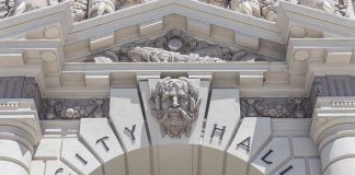 China Agent Case Triggers New Rules Close-up of the City Hall entrance with ornate architectural details
