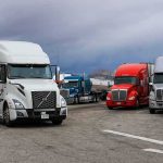 Diesel Spike Threatens Food and Freight Costs Semi trucks parked at a rest area under cloudy sky