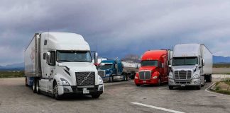 Diesel Spike Threatens Food and Freight Costs Semi trucks parked at a rest area under cloudy sky