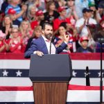 Trump Backs James Rival in NY AG Race Speaker at podium addressing a rally crowd