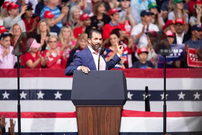 shutterstock_1651538209 Speaker at podium addressing a rally crowd