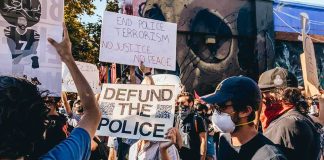 Abolition Question Leaves Activist Stuck Protesters holding signs at a street demonstration