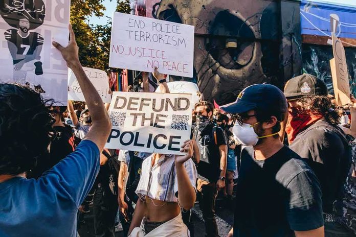 Protesters holding signs at a street demonstration